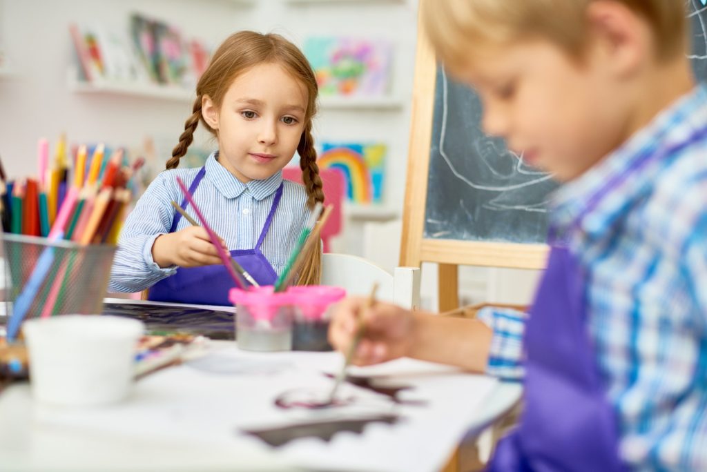 Children Painting in Art Class of Development School